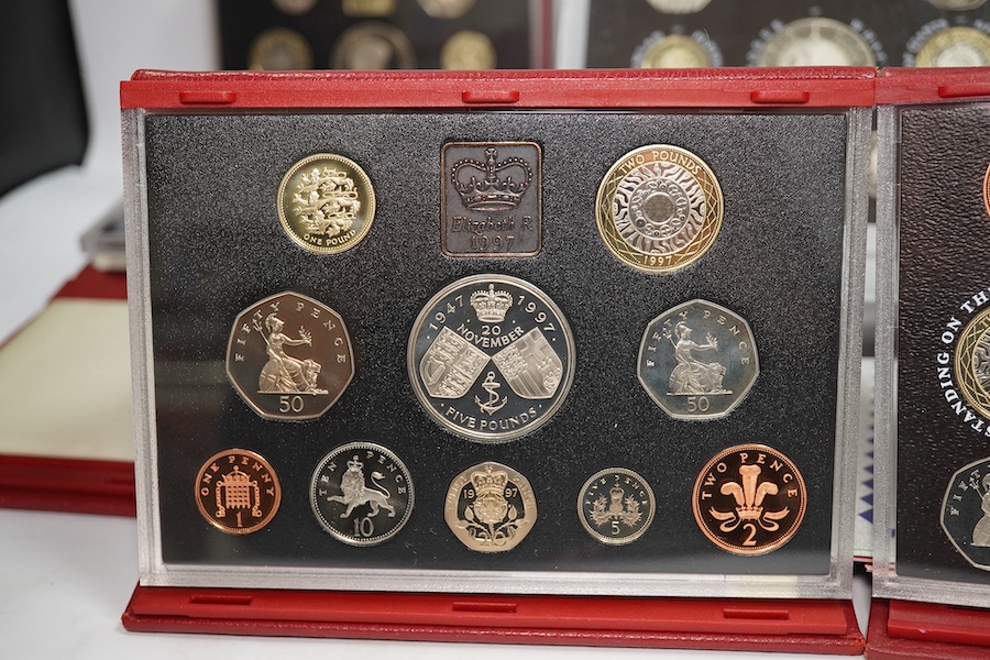 British coins, QEII, Royal Mint, seven UK proof coins sets, deluxe 1997-1999 and 2001-2003 and executive 2000